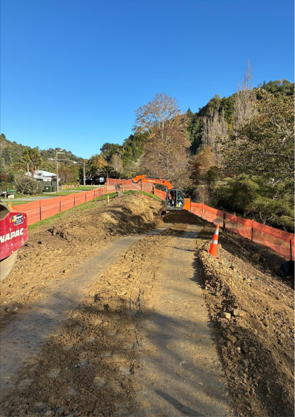 Showing a digger building the stopbank