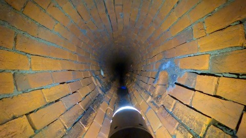 Inside the brick-lined sewer