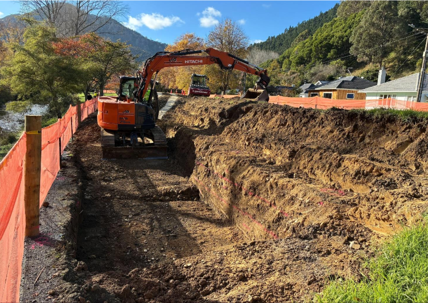 Showing a digger building the stopbank